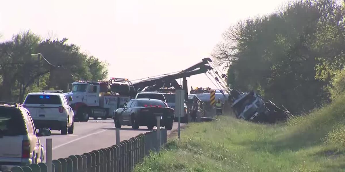 Truck from bus crash lifted back onto wheels [Video]