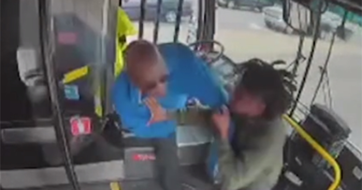 Bus driver fights off attack, crashes into business [Video]