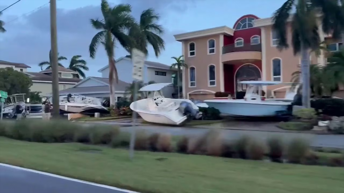 Boats seen piled against homes in Treasure Island after Helene