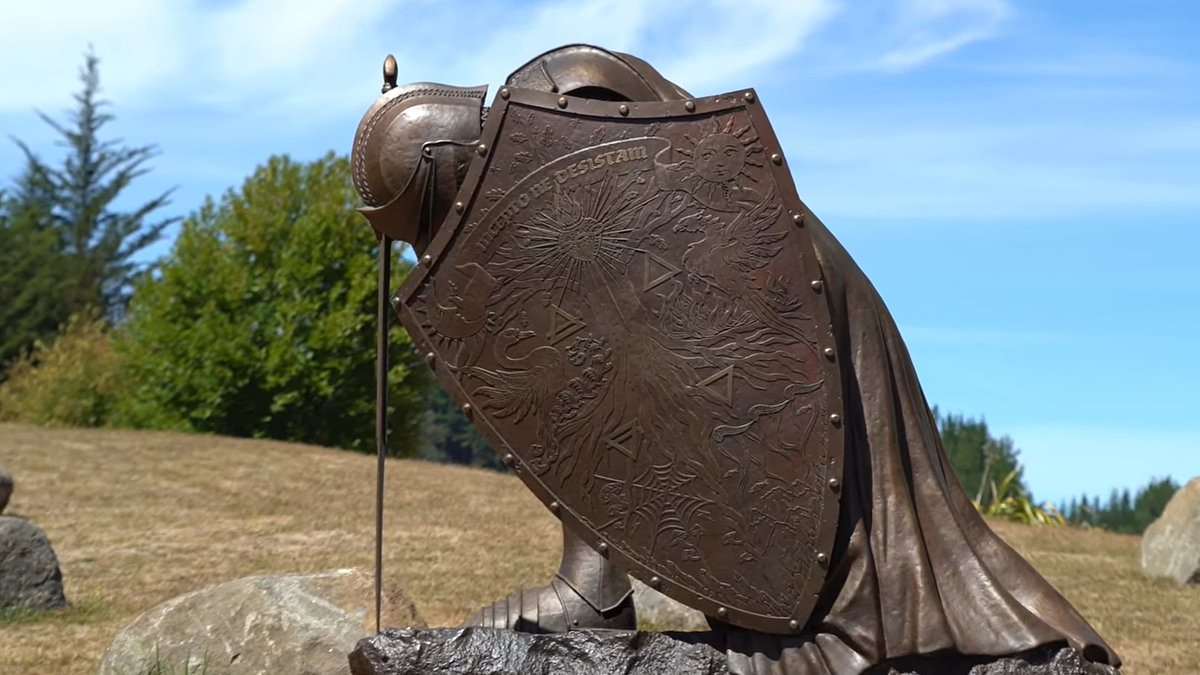 Noel Edmonds builds gigantic metal statue of a kneeling knight he has named Guardian, complete with a massive sword detailing his ‘attitude to life’ after Lloyds bank victory [Video]