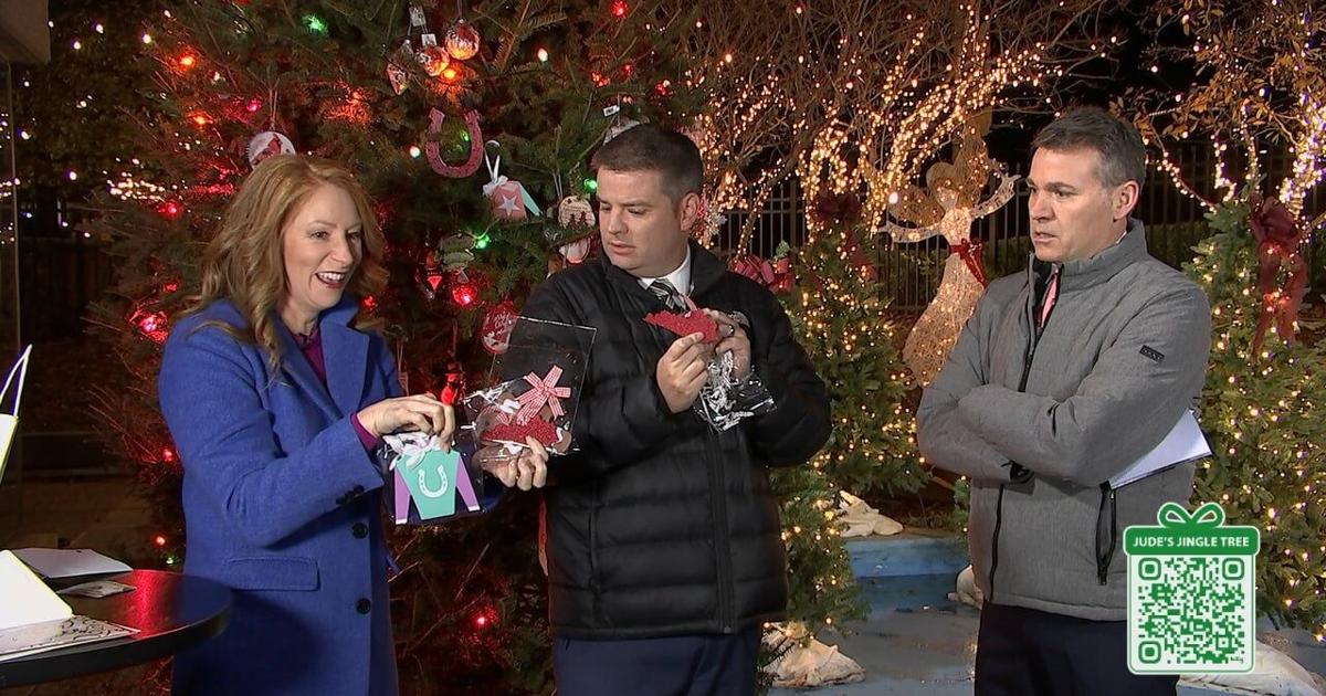 Candyce, Chris, and Jude open bags of ornaments from a small local business in downtown Louisville | [Video]